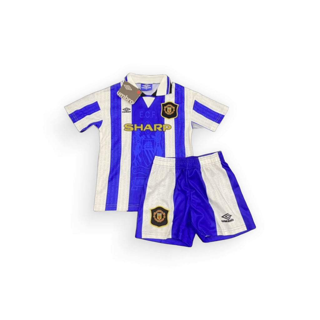 Kids Manchester United Third Retro Kit 95/96, showcasing a white and blue striped design with the Manchester united crest and the "SHARP" sponsor logo.